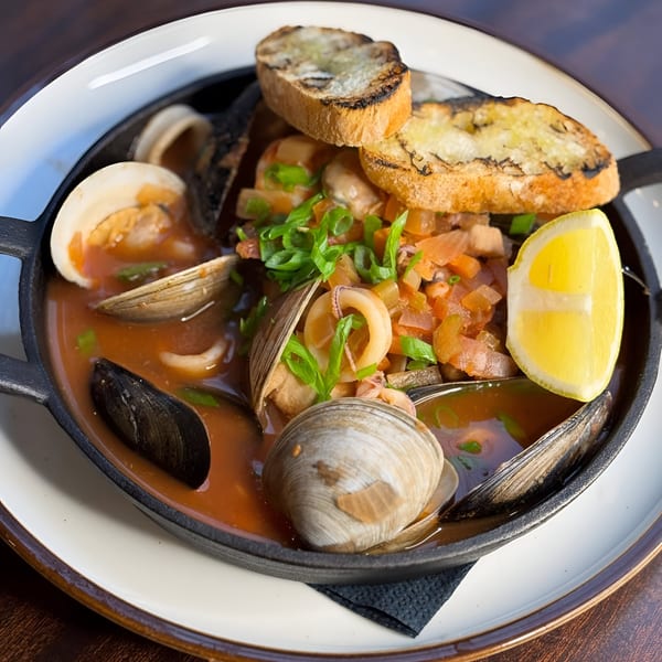 A Black Oak on Fifth Italian seafood stew with clams, mussels, squid, and toasted bread.