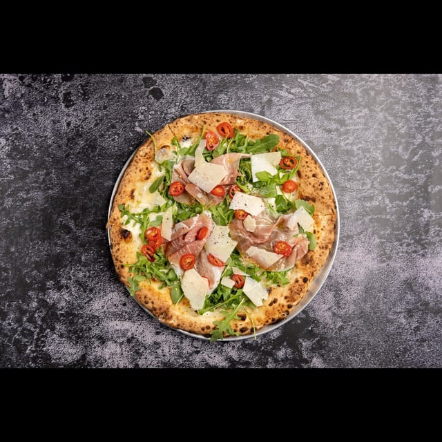 Prosciutto Arugula Pizza.